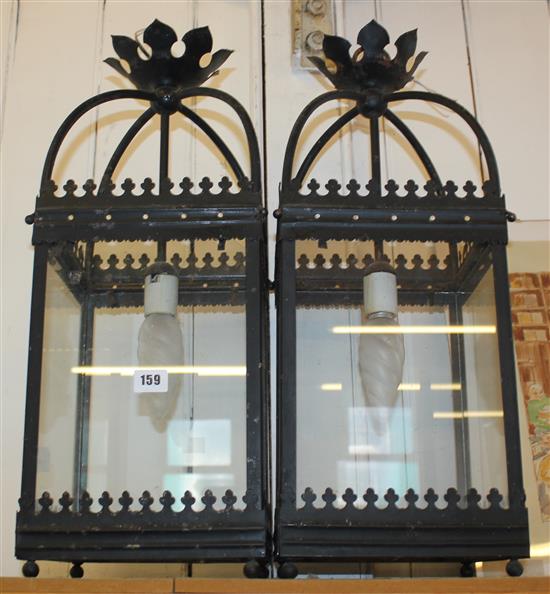 Pair of black painted lanterns